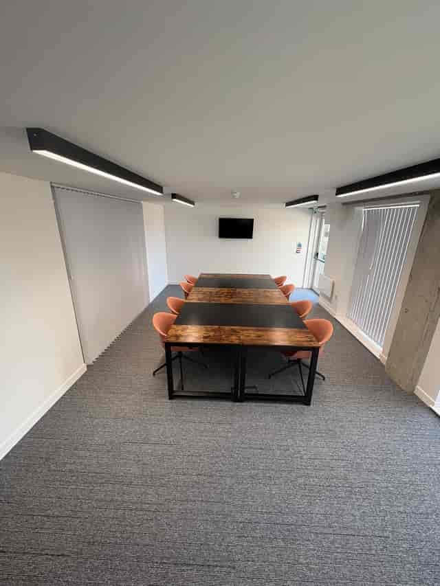 Banning Street boardroom with long table for private team meetings and professional brainstorming.