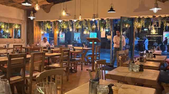 Rustic-chic Oxford brunch bar featuring communal seating for networking mixers and dining events.
