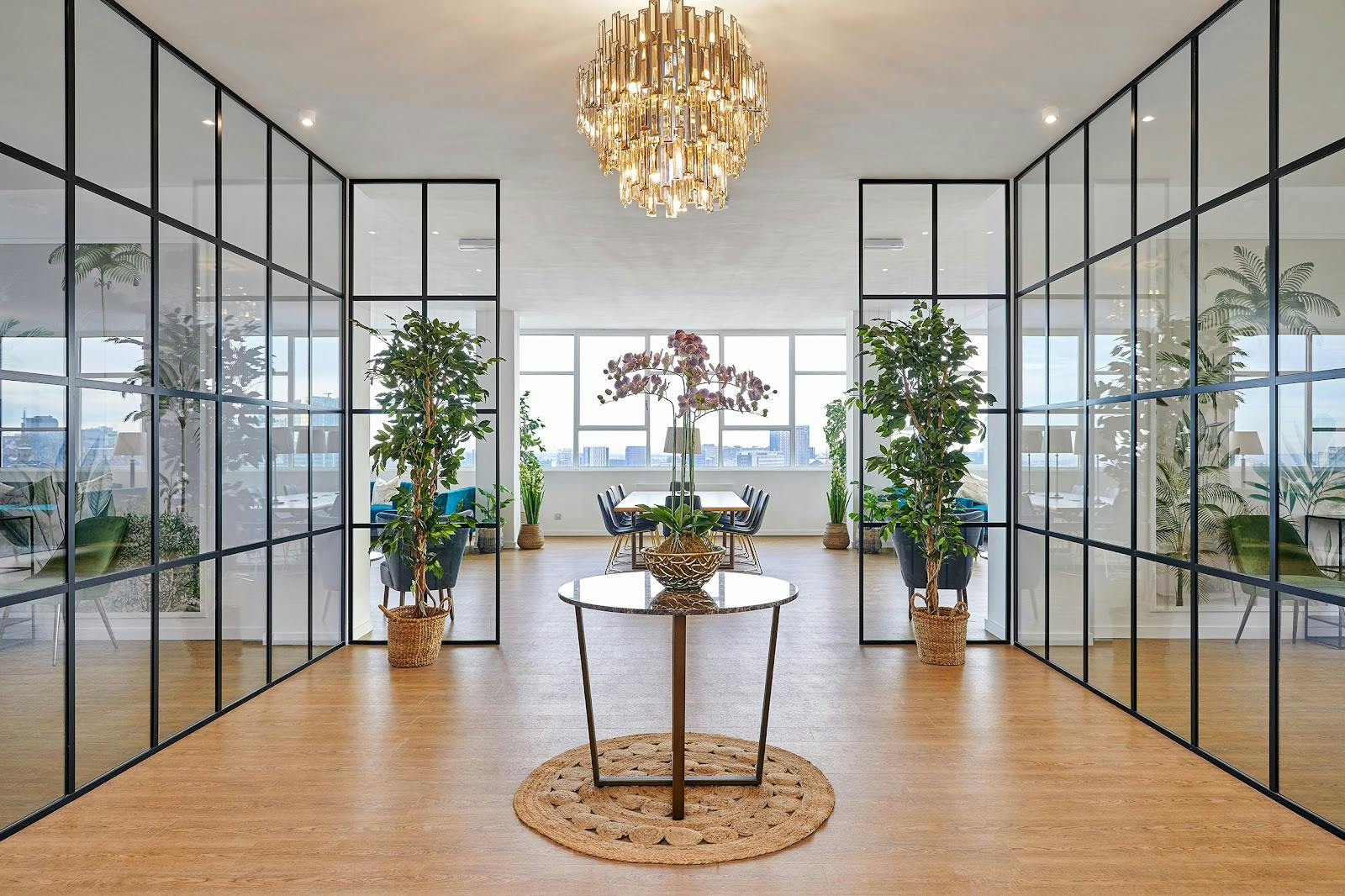 Modern glass-partitioned meeting room for upscale corporate events and breakout sessions. - Banner