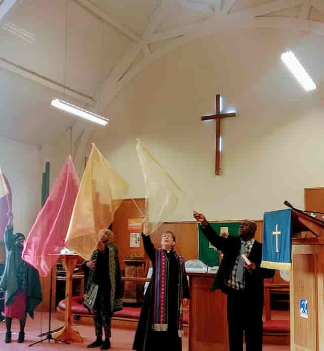 Lozells Methodist Church worship service with liturgical dance flags for community events.