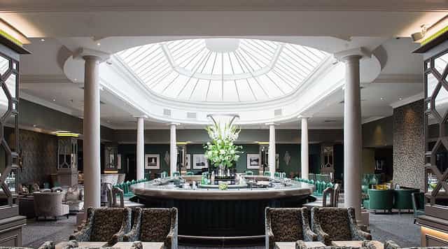 Sophisticated bar venue with floral decor, perfect for corporate events and social gatherings.