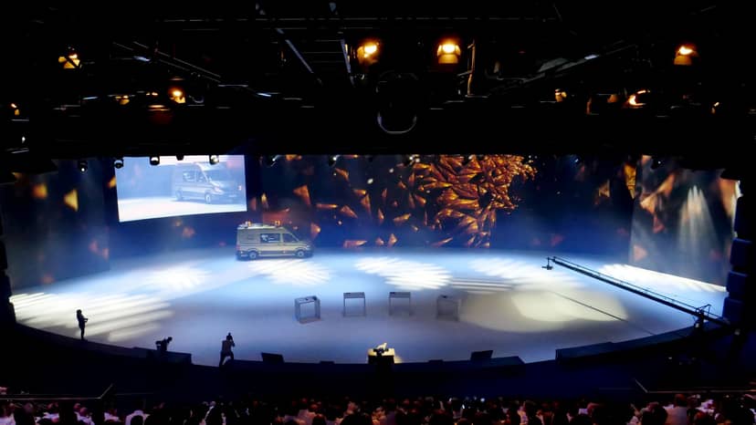 Automotive brand launch at Showpalast München featuring LED backdrop and stage lighting.