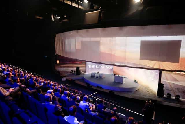 Showpalast München stage with curved panoramic screen for keynote presentations and business events.