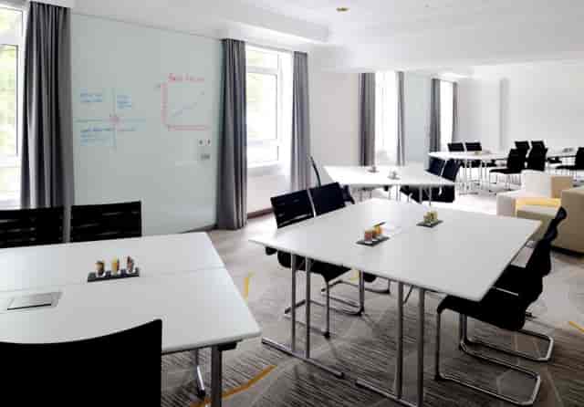 Munich Marriott breakout room with whiteboard walls for collaborative workshops and business meetings.