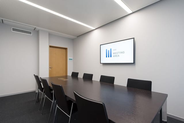 Minimalist HBW Conference Center boardroom for tactical business meetings and corporate strategy.