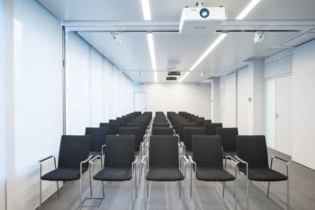 Modern theater-style event room for professional seminars and presentations.