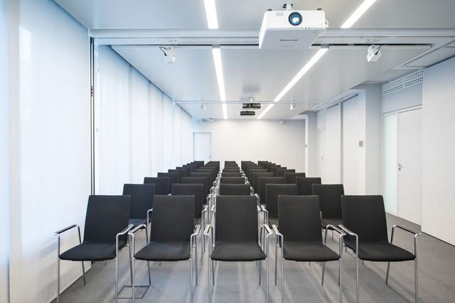 Modern theater-style event room for professional seminars and presentations.