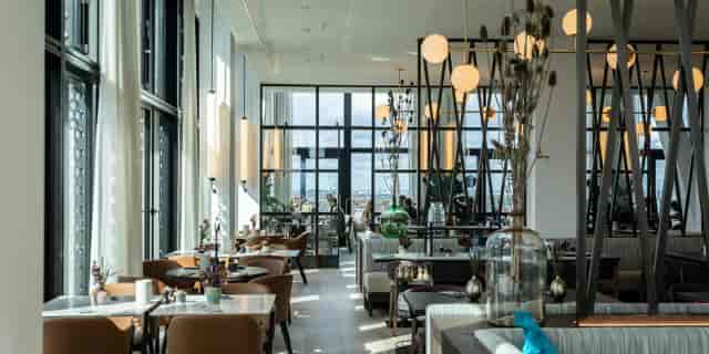 Modern FITZROY Munich restaurant interior for corporate events and VIP private dining.