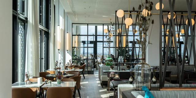 Modern FITZROY Munich restaurant interior for corporate events and VIP private dining.