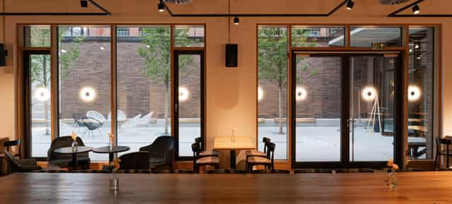 Y.OUR Pavillon cafeteria with floor-to-ceiling windows for networking and corporate events.