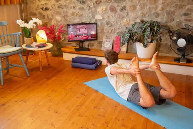 Yoga studio at Schlosspalais with curated decor for hybrid wellness and virtual fitness sessions.