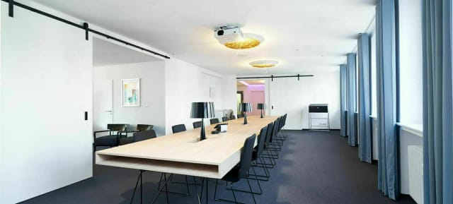 Modern boardroom with A/V tech for corporate meetings and strategic event planning.