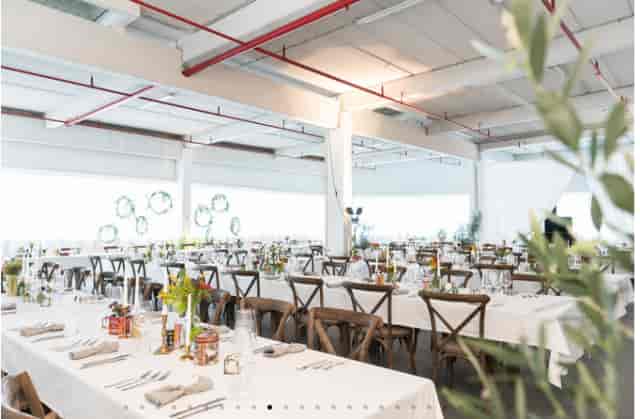 Industrial-chic event venue, Füllhalle und Orangerie, set for a modern wedding or corporate gala.