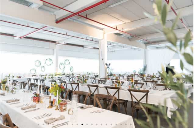 Industrial-chic event venue, Füllhalle und Orangerie, set for a modern wedding or corporate gala.