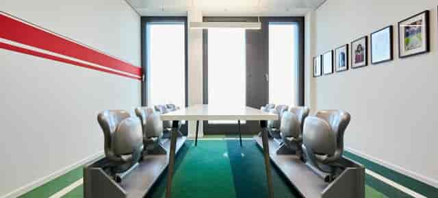High-design boardroom at DECK7 with linear seating for corporate meetings and executive events.