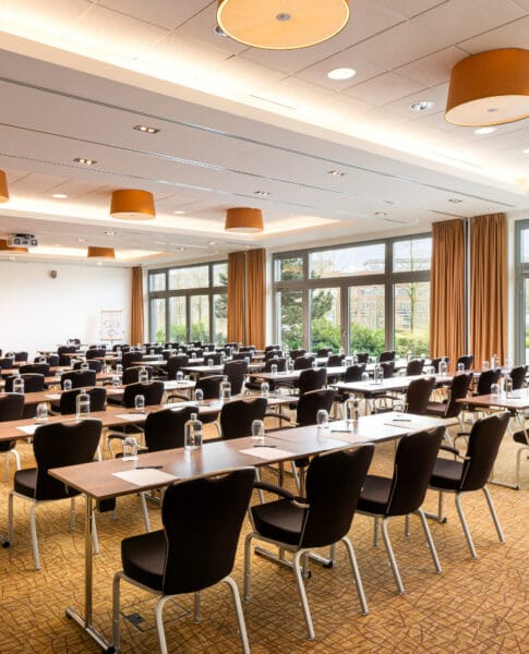Classroom-style conference room at elaya hotel Munich, ideal for training workshops and events.