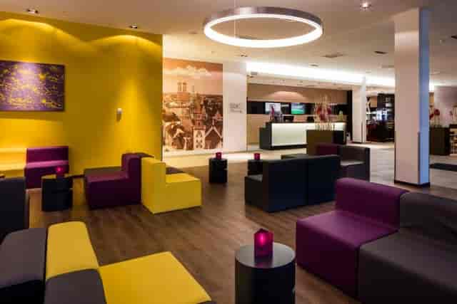 Modern business lounge at Star G Hotel Munich, ideal for corporate networking and event registration.