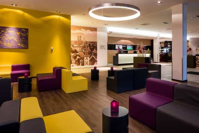 Modern business lounge at Star G Hotel Munich, ideal for corporate networking and event registration.