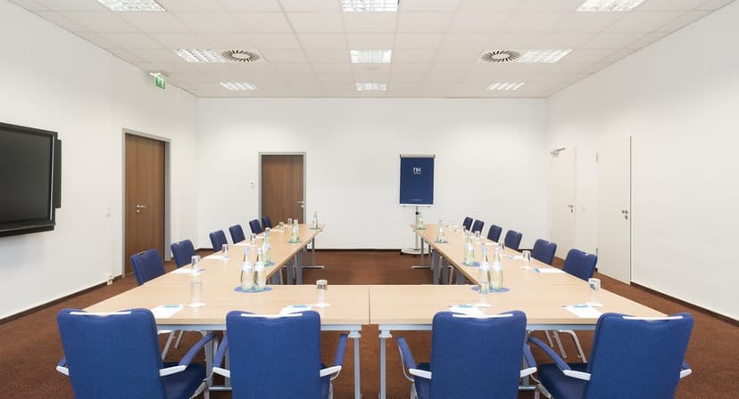 U-shape boardroom at NH München Ost Conference Center for corporate training and team meetings.
