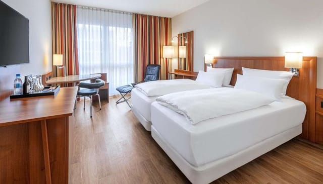 Twin guest room at NH München Ost Conference Center for corporate events and business travel.