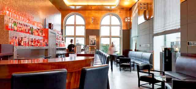Upscale lounge at ISArBAR with elegant bar for cocktail receptions and networking events.