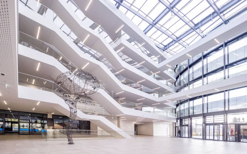 Sun-drenched Brainlab Tower atrium for corporate events and cocktail receptions.