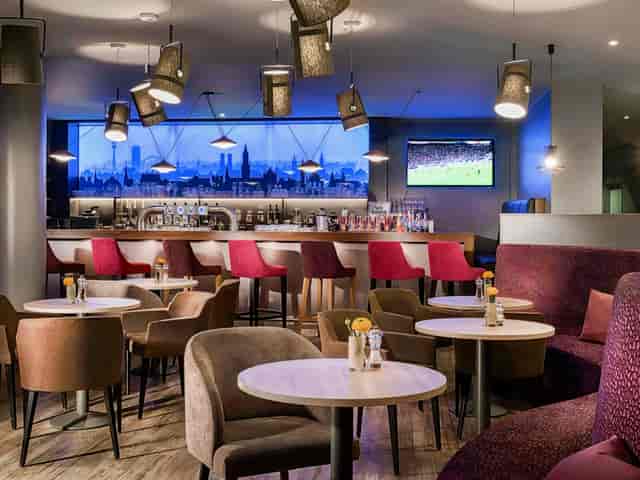 Contemporary hotel bar in Munich for professional networking and corporate event breakouts.