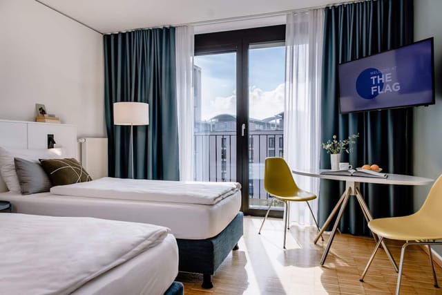 Modern hotel room with bright workspace for business travel and remote work.