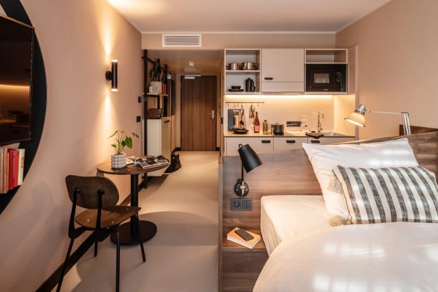 Modern studio apartment in Revo Munich for business travel and extended-stay workspace.