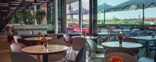 Café Exponat event space at Deutsches Museum with open-plan layout for networking and receptions.