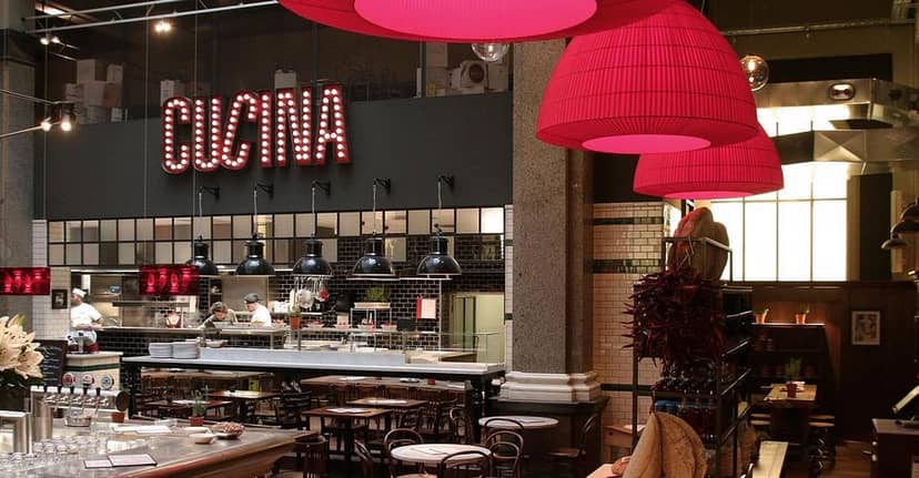 Industrial-chic restaurant suite with open kitchen for networking events and team lunches.