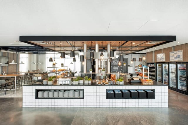Modern corporate catering station at H2 Hotel München Olympiapark for business event refreshment.