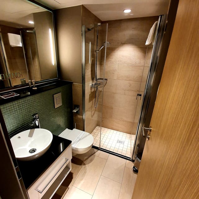Modern NYX Hotel Munich bathroom: functional business travel space for corporate event stays.