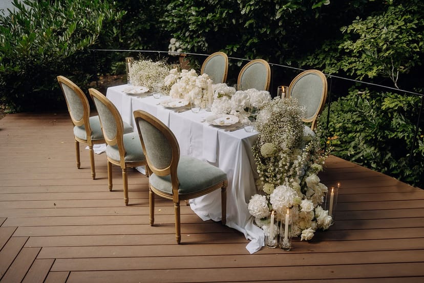 Intimate outdoor dining setup with floral decor for luxury micro-weddings and boutique events.
