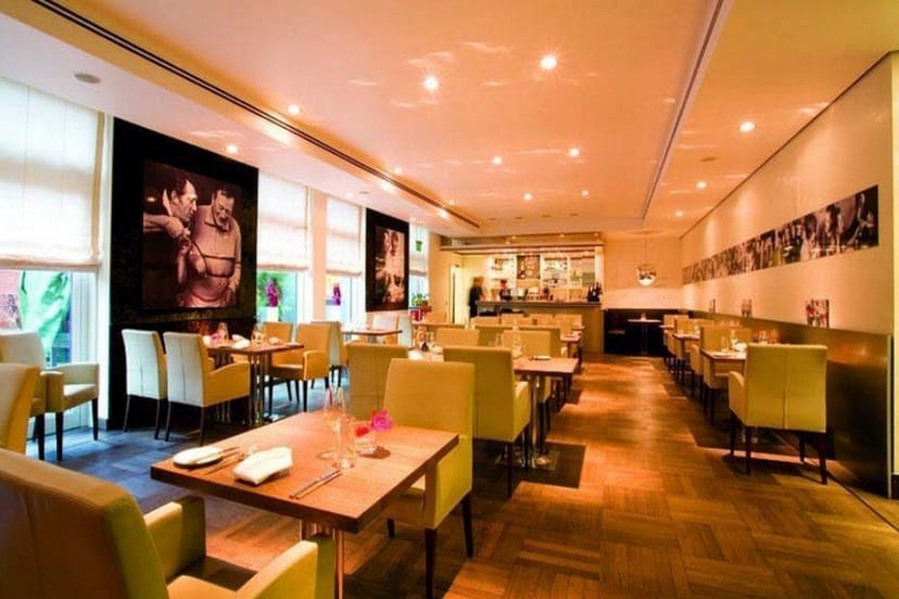 Upscale restaurant with warm lighting for corporate dinners and networking events.