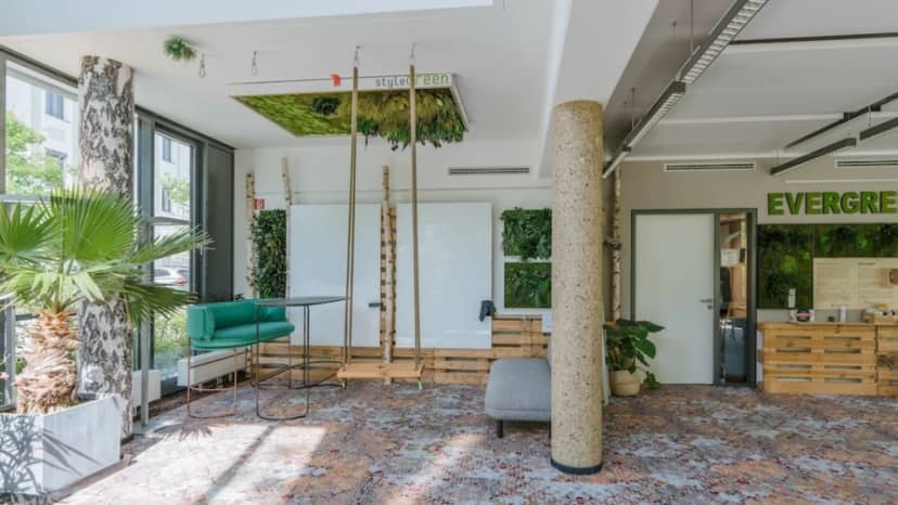 Biophilic breakout space at Berghain featuring flexible seating for creative collaboration and events.