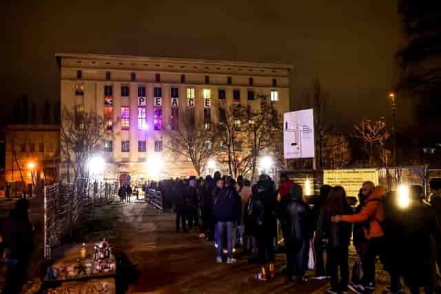 Berghain event venue: dense crowd queueing at entrance for experiential clubbing and nightlife.
