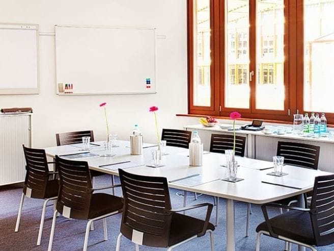 Agendis Business Center boardroom with ergonomic seating for business meetings and conferences.
