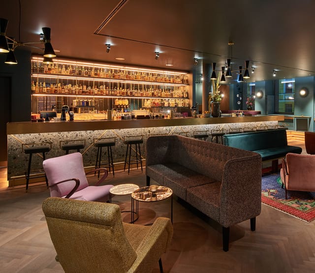 Luxury boutique lounge with bar for executive networking and corporate receptions.