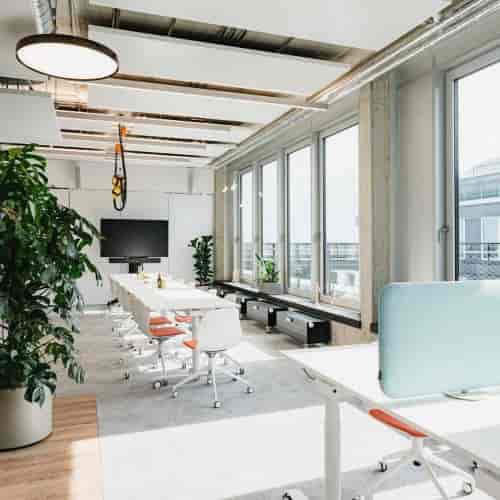 Modern boardroom with biophilic design for hybrid meetings and professional corporate events.