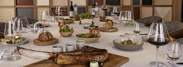The LOUIS private dining room set for a corporate boardroom dinner or VIP networking event.