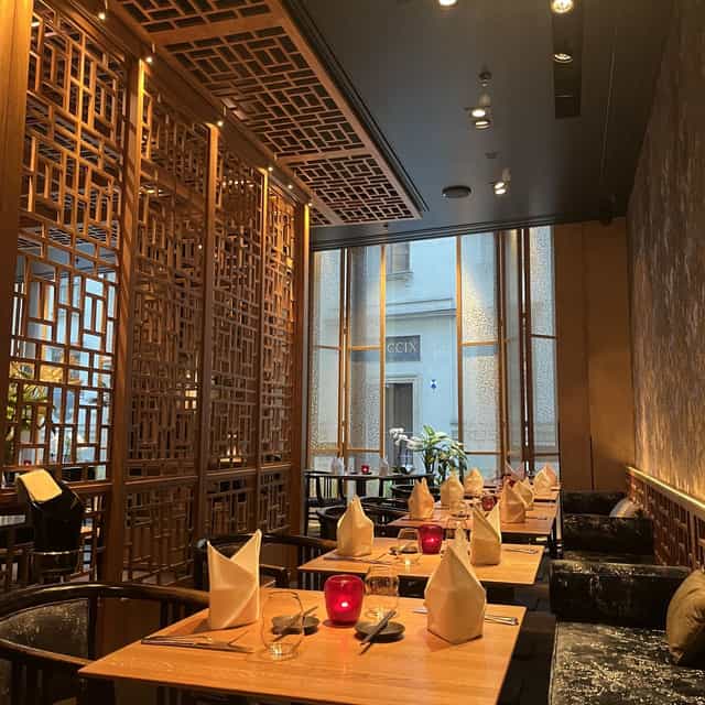 Azuki München private dining room with elegant woodwork for corporate dinners and receptions.