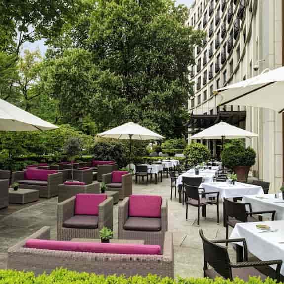 Upscale hotel terrace with lounge seating for outdoor cocktail reception and networking events.