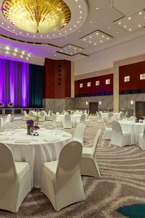 Titan Meeting Room gala dinner setup with purple LED lighting for corporate events and weddings.