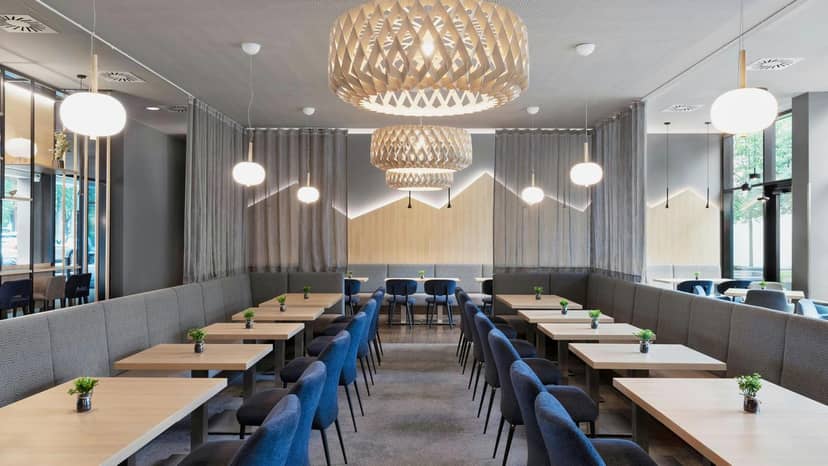 Modern meeting room with modular seating for corporate events and networking in Munich.