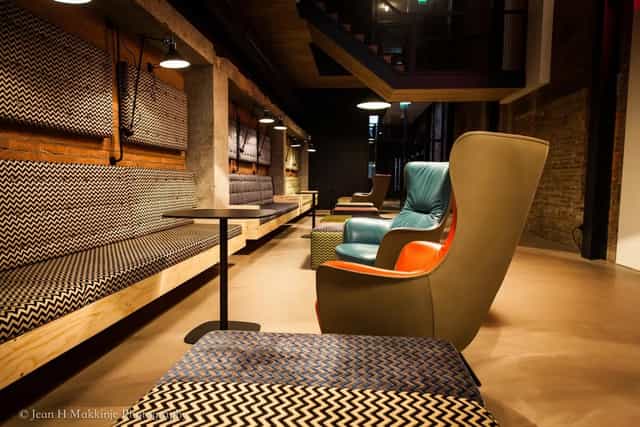 Foyer breakout space at Oude Luxor Theater with lounge seating for networking and corporate events.