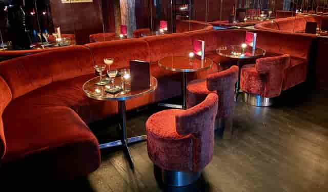 Plush velvet booths at Vault Bar Lina Shoreditch for VIP networking or corporate event receptions.