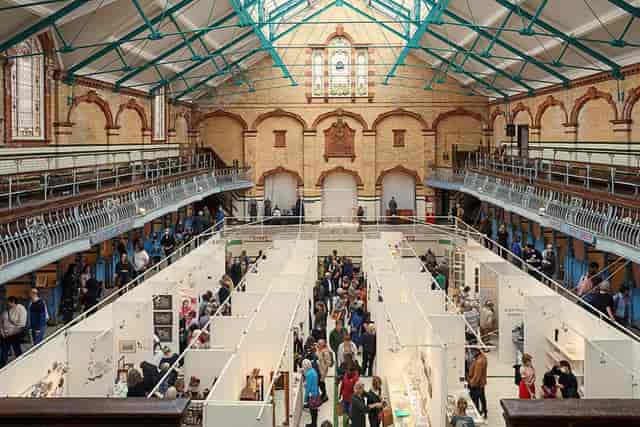 Victoria Baths Gala Pool trade show with modular stands in a historic event venue.