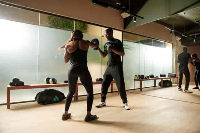 Dynamic workout session in a wellness studio, ideal for corporate team-building events.