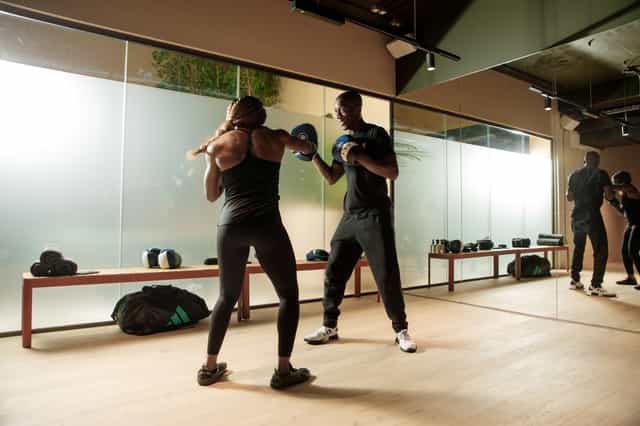 Dynamic workout session in a wellness studio, ideal for corporate team-building events.